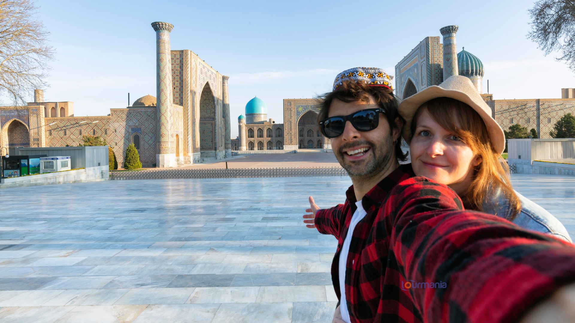 Happy tourists in Registan square