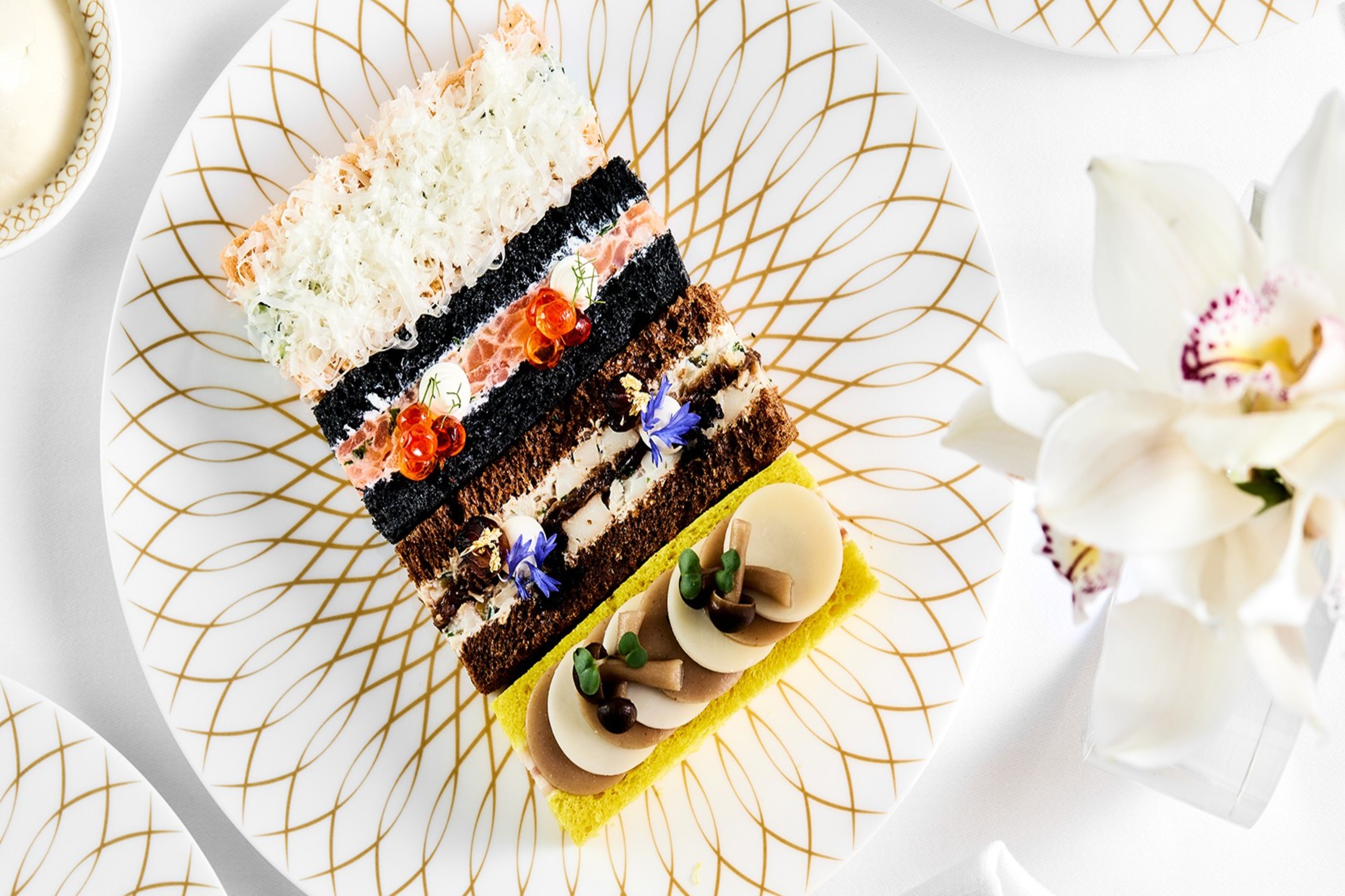 Exquisite layered delicacies at Plato’s Lounge—where artistry, flavor, and luxury meet in every bite