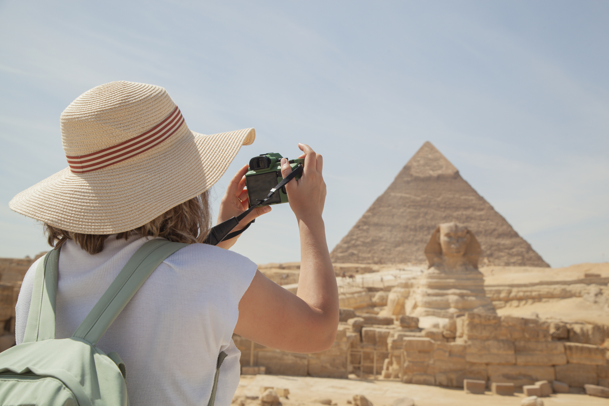 Traveler photographing the Sphinx and Pyramids