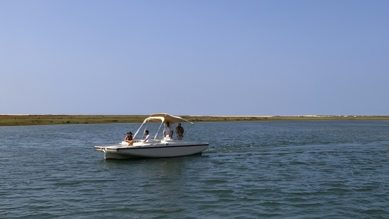Explore the tranquil waters of Ria Formosa while minimizing your environmental footprint