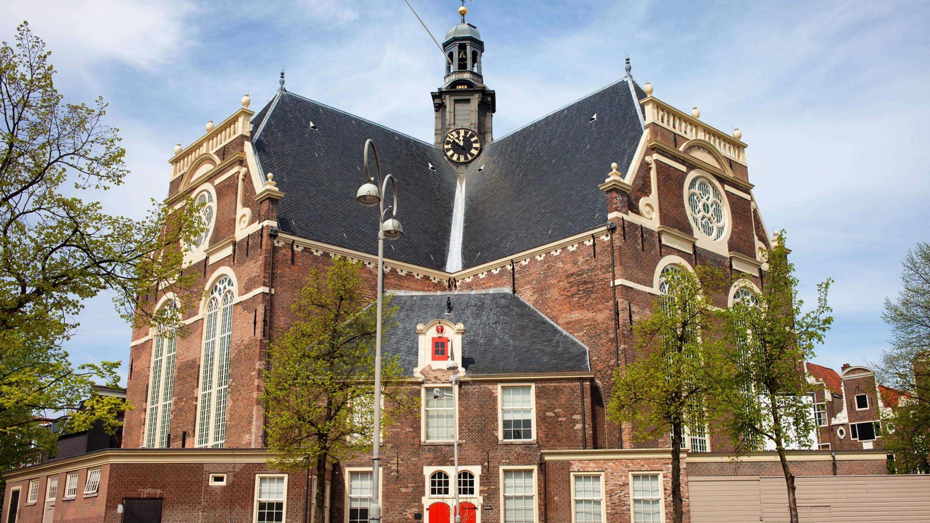 Stunning exterior view of the historic building, glowing warmly in evening light