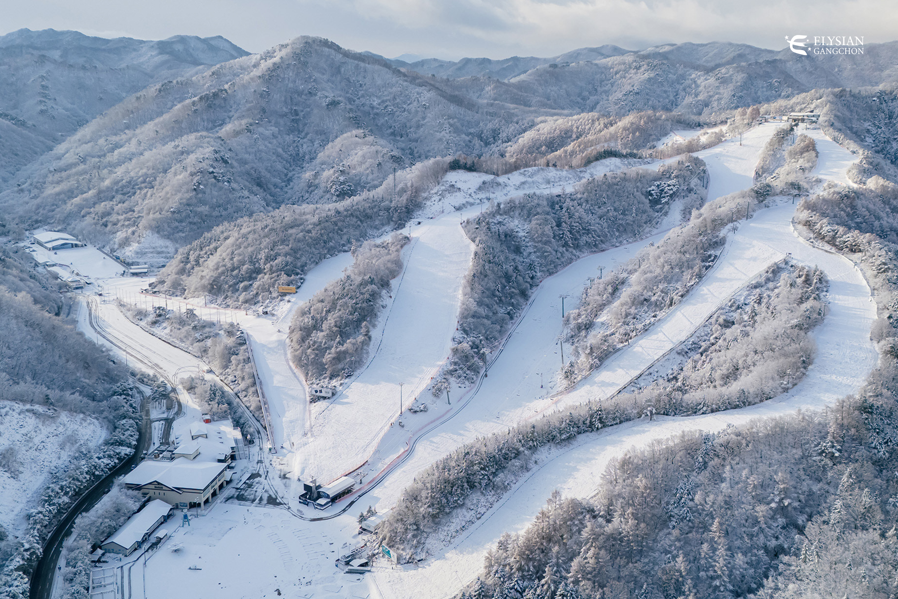 resort guests with ropeways in the background