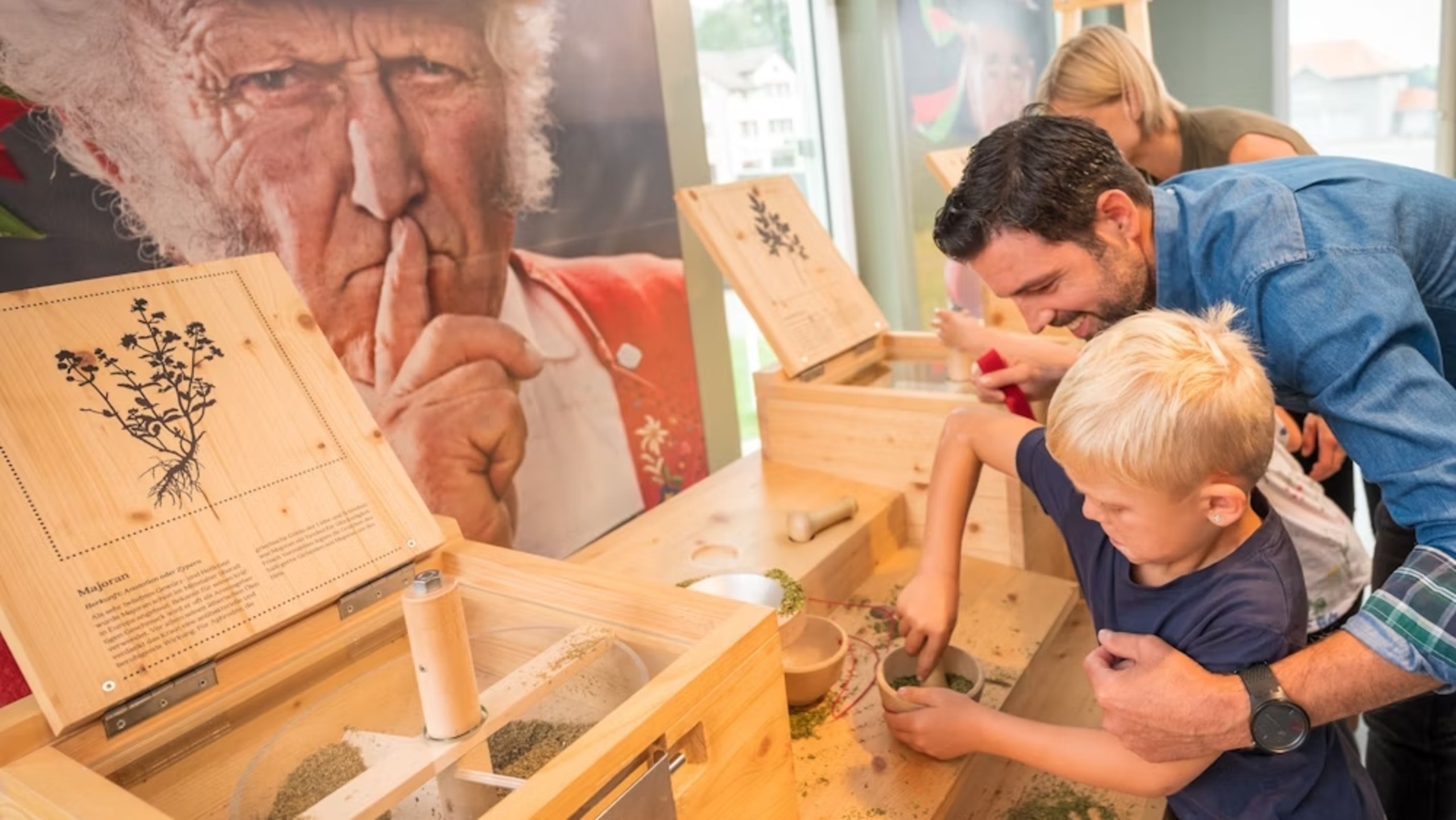 Enjoying the interactive experience with the adorable house mouse 'Chäsli Jakob' at Appenzeller