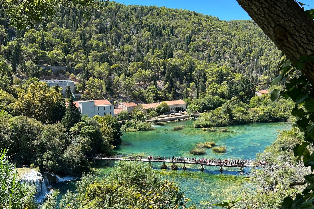 Discover the natural wonders of Krka National Park, where waterfalls cascade amidst lush greenery