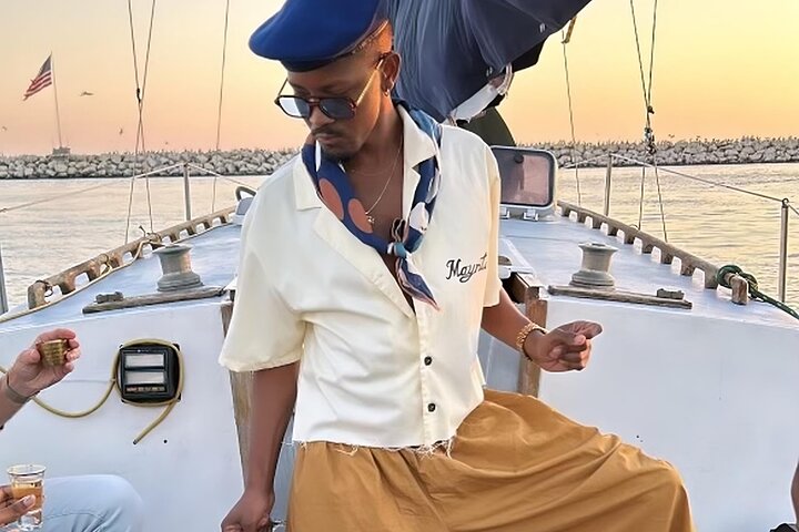 Relax aboard a classic sailboat while admiring the scenic marina views