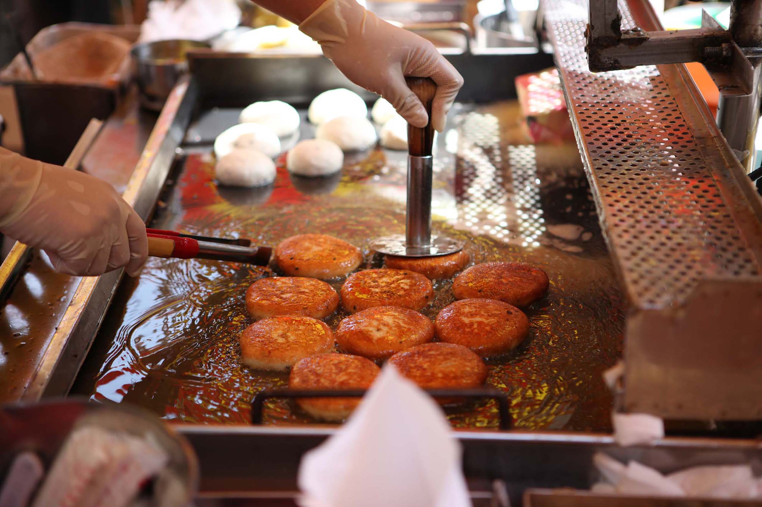 Dive into South Korea’s largest market on the south side, where you can taste fresh catches on the spot. Just a short walk away, BIFF Square and Gukje Market offer bustling street snacks, local history, and shopping fun.