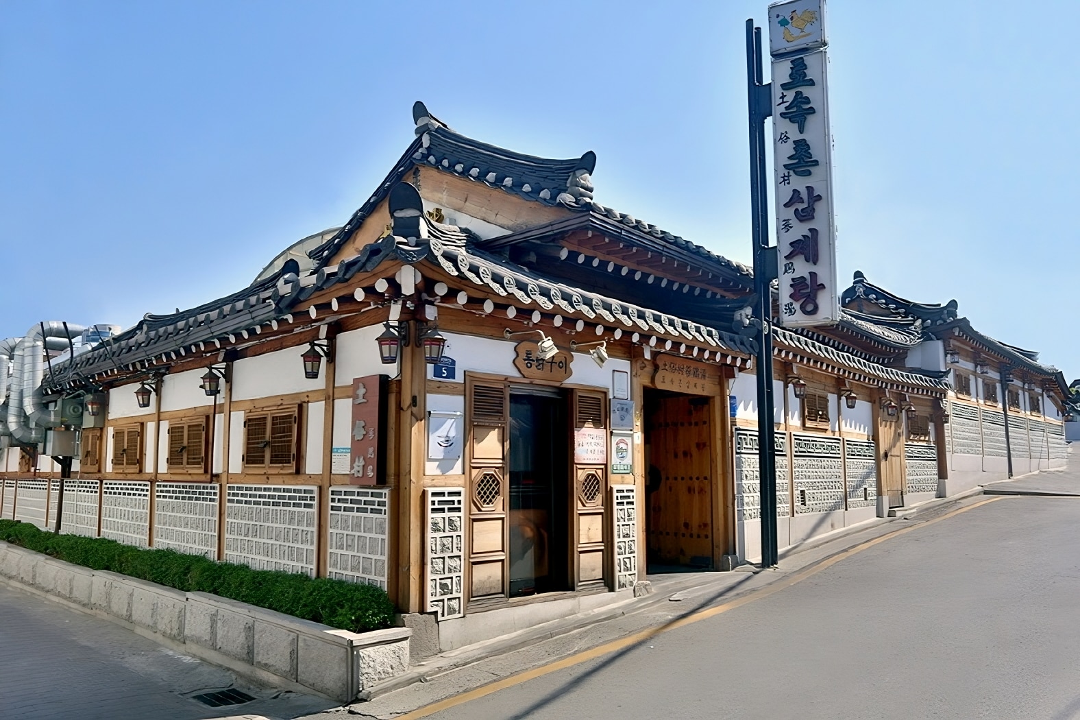 The inviting exterior of Tosokchon, serving authentic Korean dishes with a cozy atmosphere.