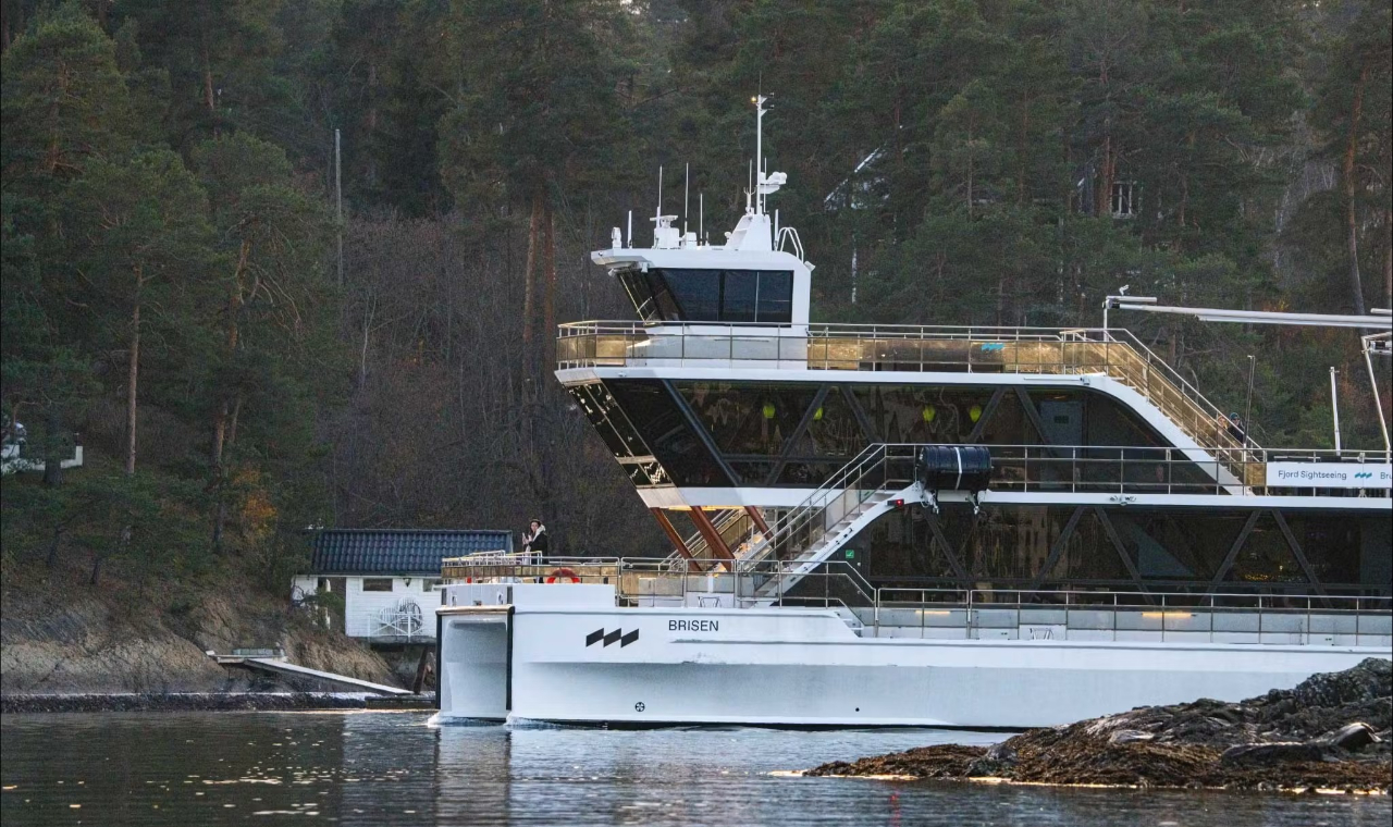 A cruise boat docked calmly at the pier, ready for passengers to board