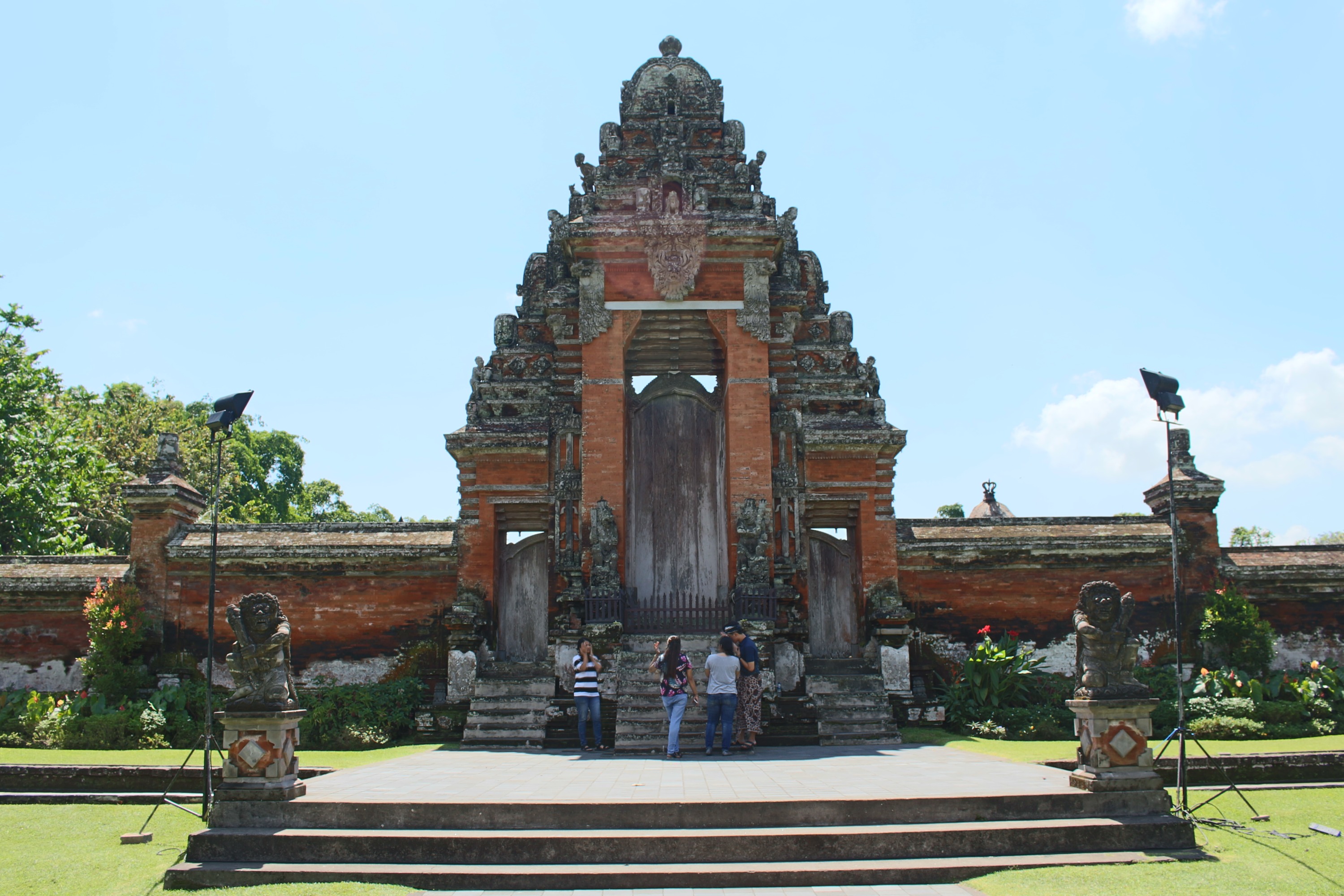 Take some beautiful photos wearing Balinese traditional costume in front of this iconic gate at Taman Ayun temple