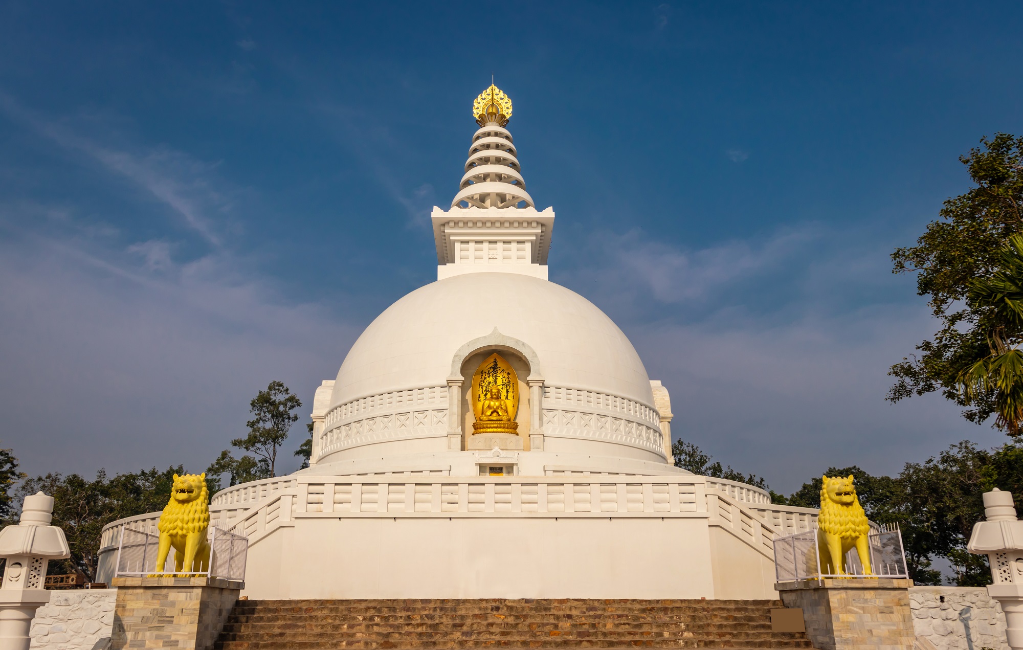 Buddhist stupa isolated with amazing blue sky from unique perspective image is taken at Vishwa Shanti Stupa in Rajgir. This stupa is symbol of world peace.
