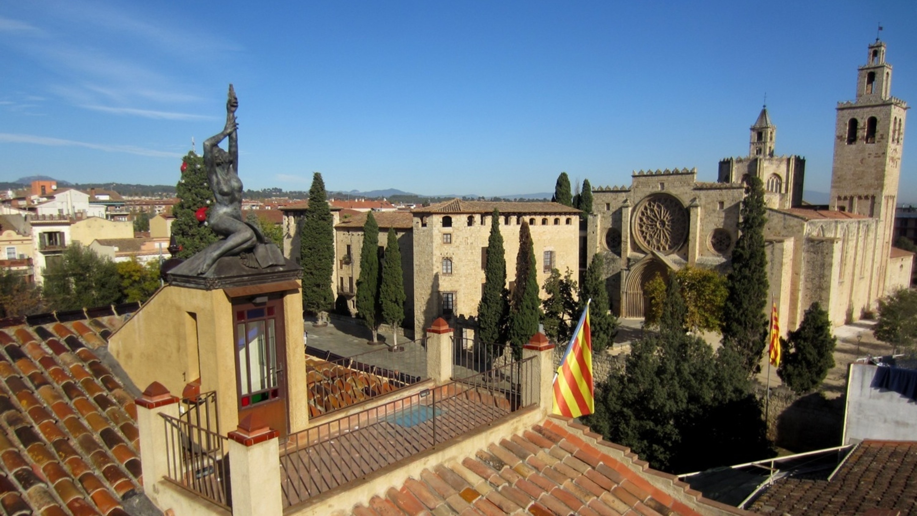 Museum exterior seen from afar, showcasing historic architecture in the heart of Sant Cugat