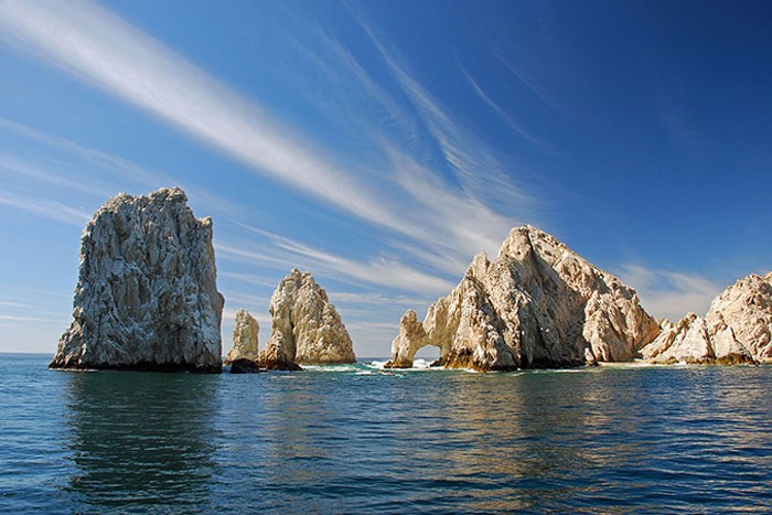 Enjoy a serene journey along Los Cabos' coastline, surrounded by picturesque scenery