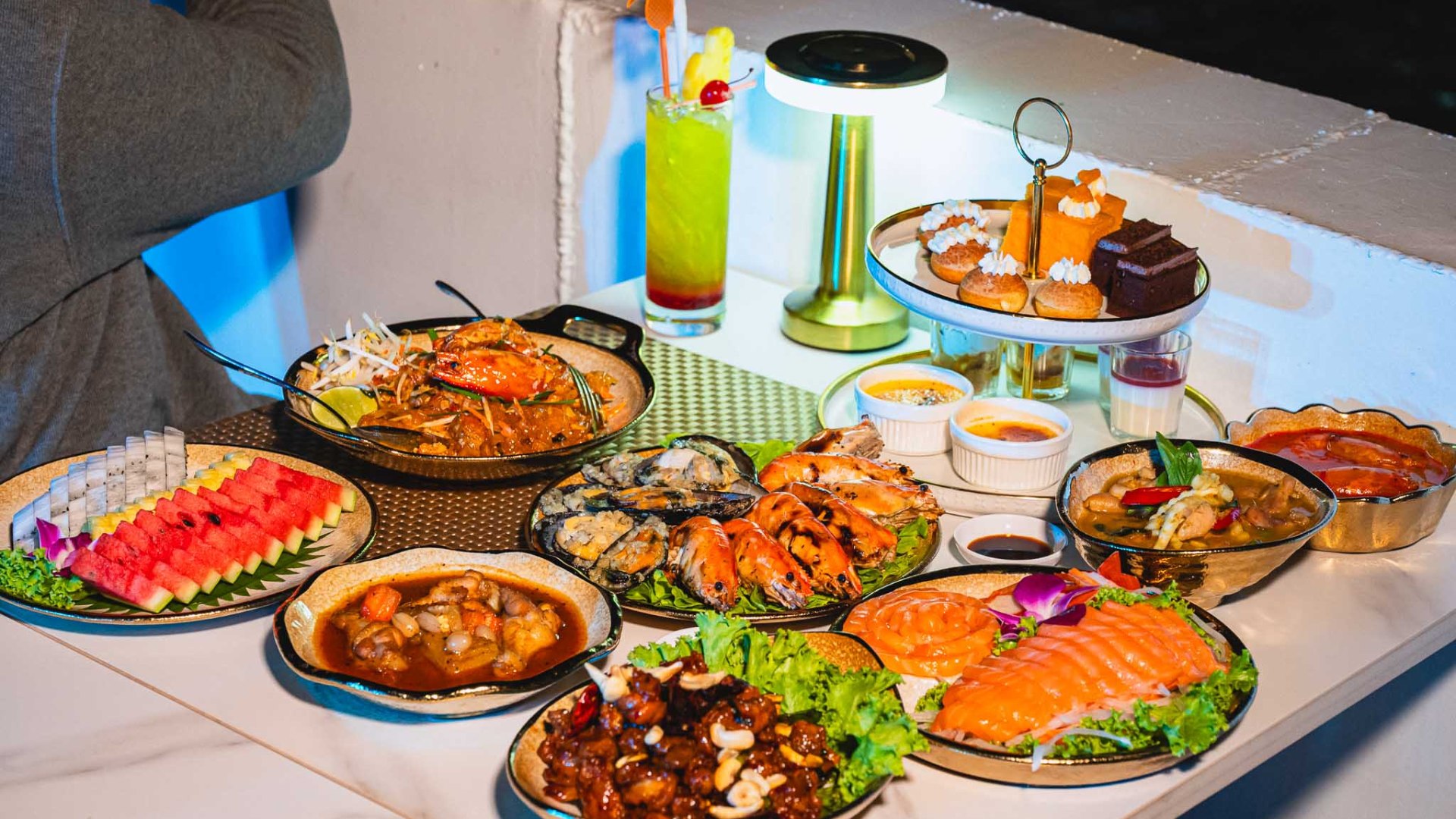 Indulge in a premium seafood buffet featuring local river prawns and Japanese-style sashimi Indulge in a premium seafood buffet featuring local river prawns and Japanese-style sashimi