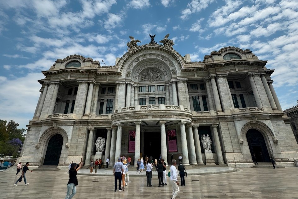 Elegant museum corridor with high ceilings and detailed decorative architectural elements