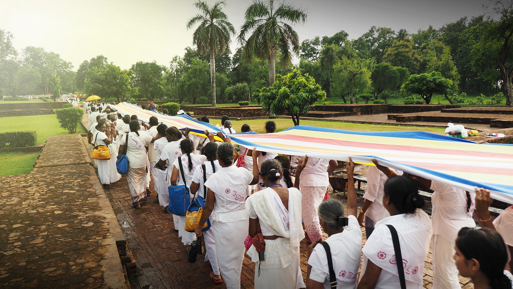 Shravasti,  Nationals of Sri rang Ka parade together of Flags in Buddhism at Jetavana Temple with our Guide.