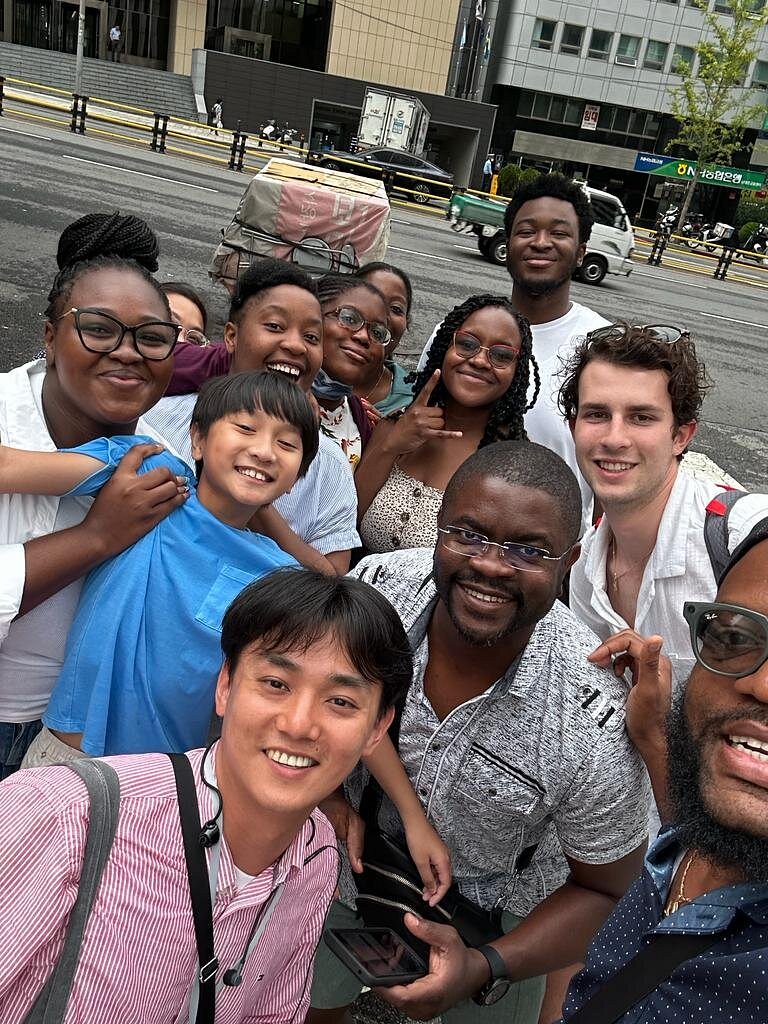 people taking a picture with a guide