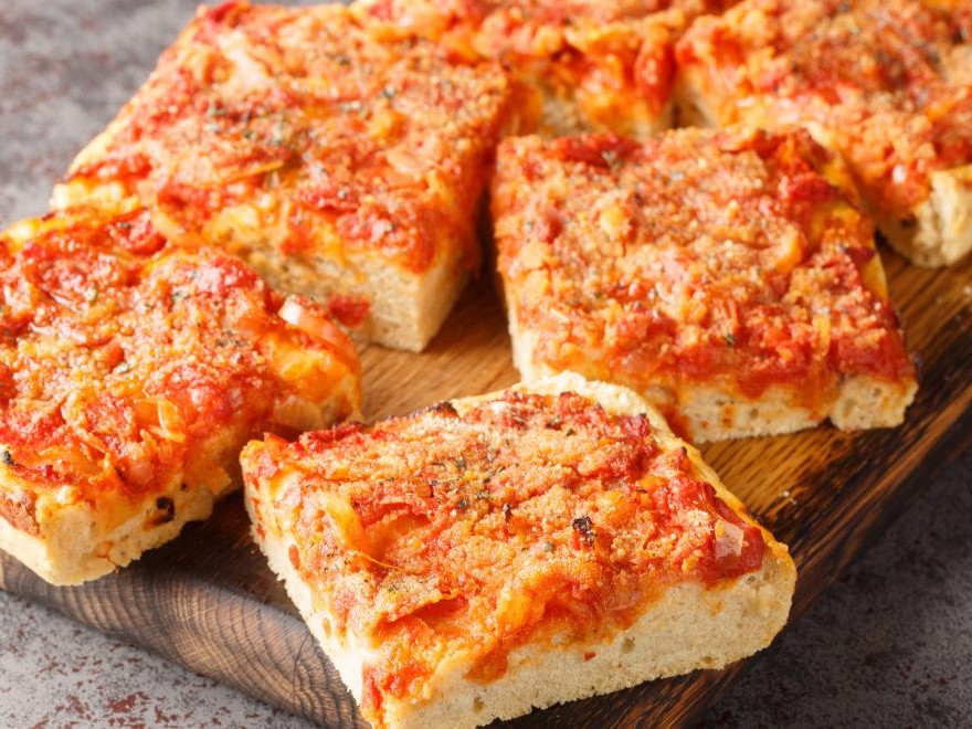 Enjoy a classic Brooklyn slice at L&B Spumoni Gardens, a legendary pizzeria