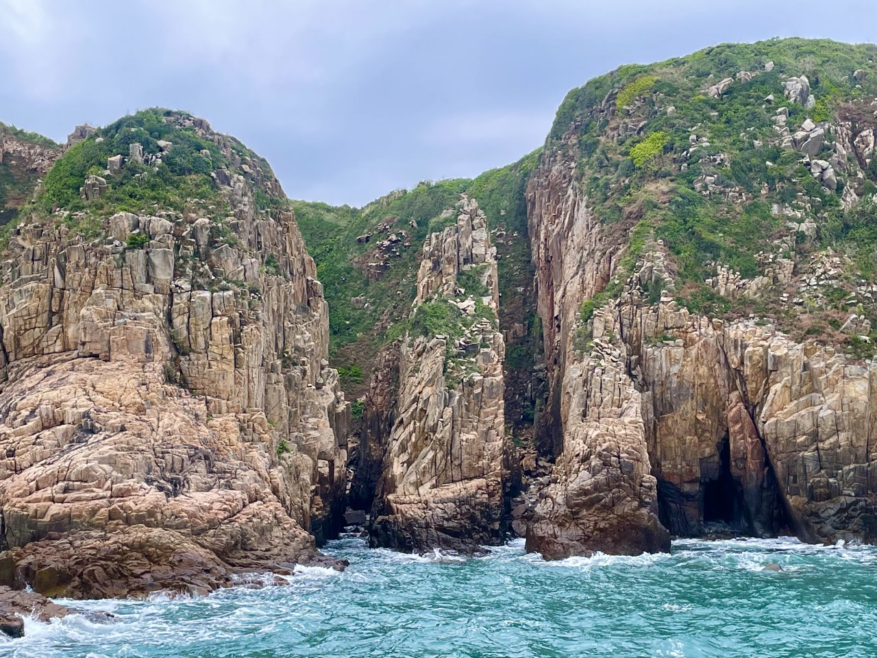 Praying Hand Cliffs, Bluff Island, Hong Kong UNESCO Global Geopark (Yacht Cruise through Four Sea Arches Volcano in Hong Kong)