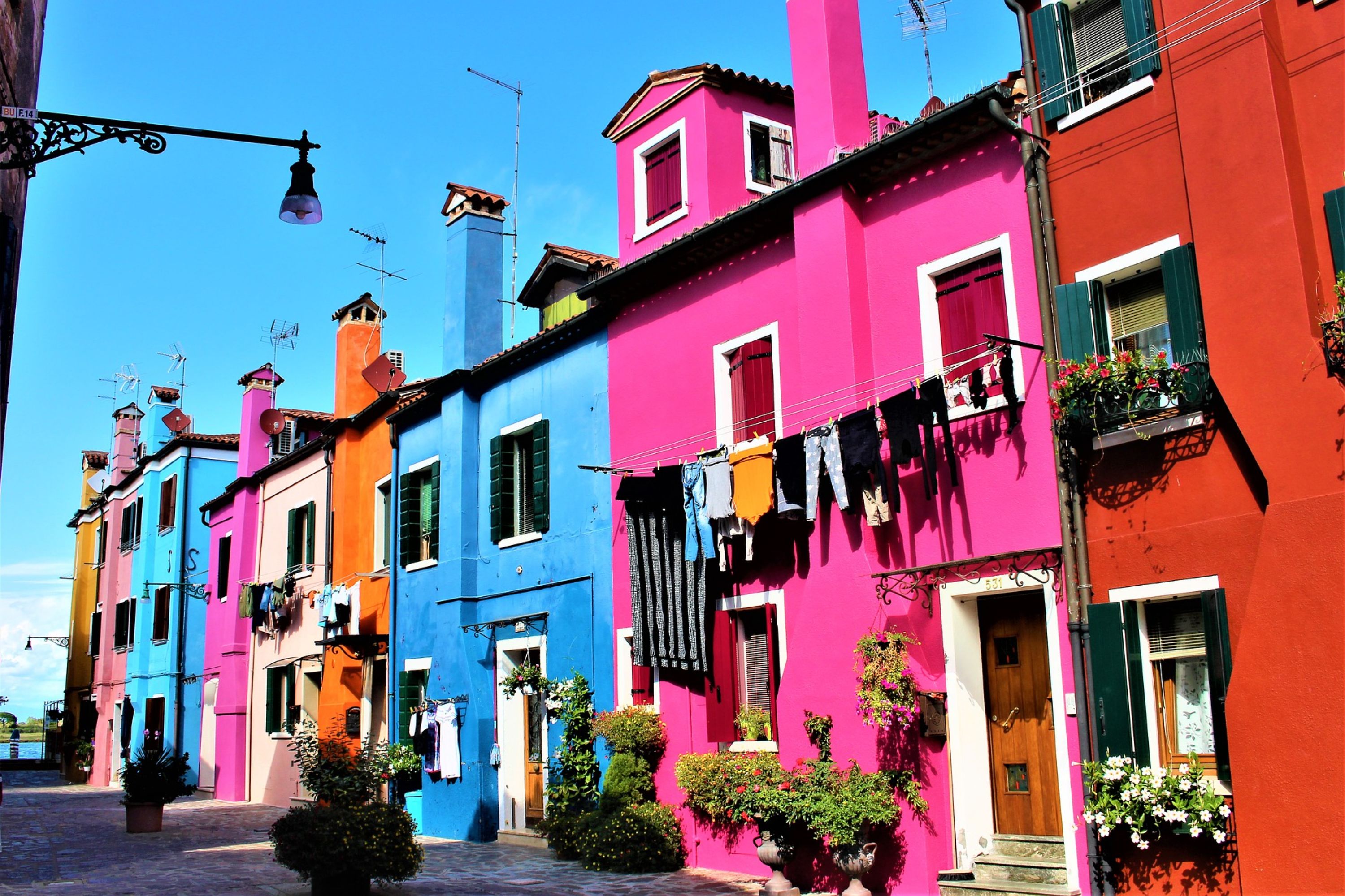 Marvel at the bright, cheerful colors of Burano’s buildings, each one telling a story of its own