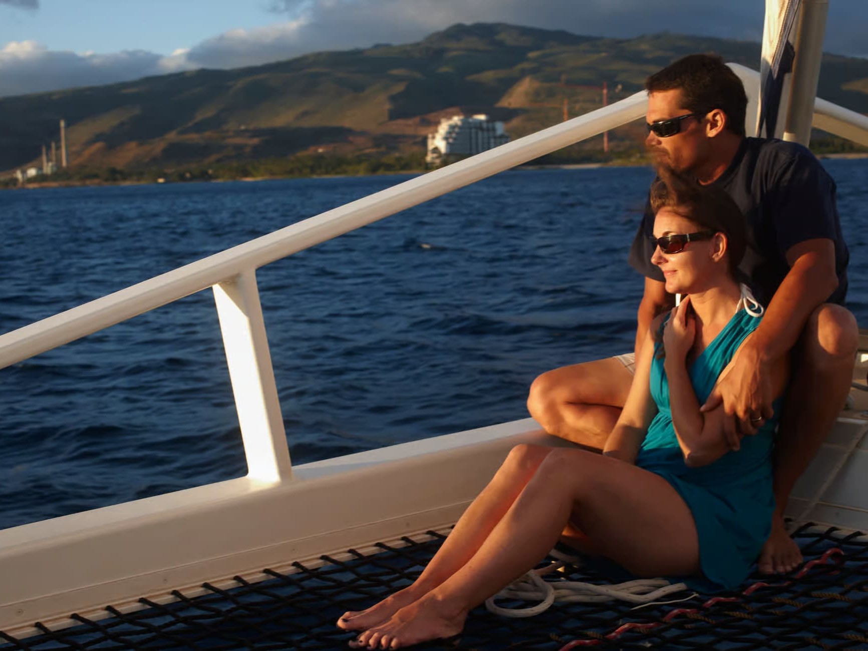 Relaxing together on deck, gazing into endless Pacific waters