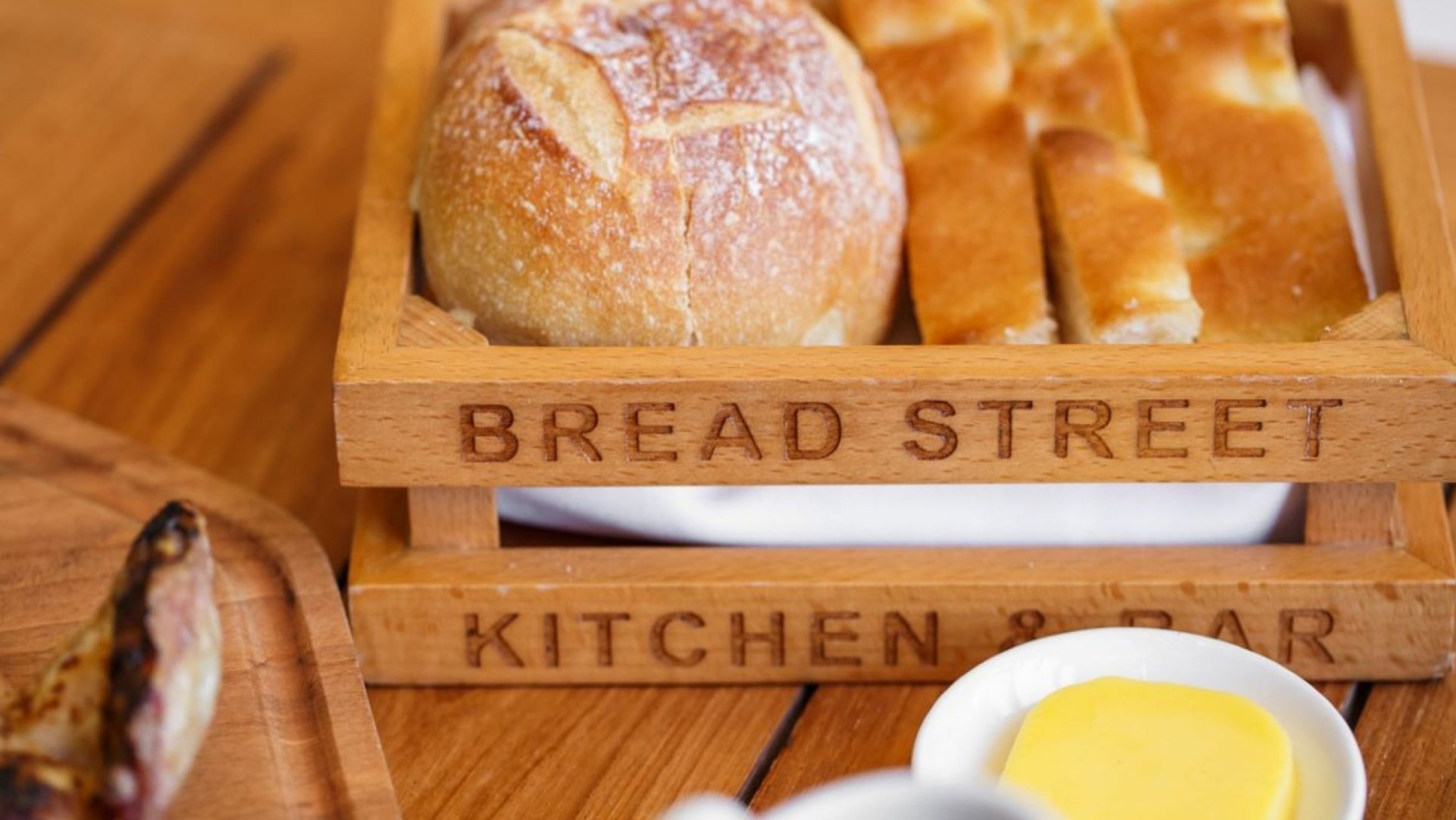 Indulging in freshly baked artisan bread, a perfect start to a memorable dining experience