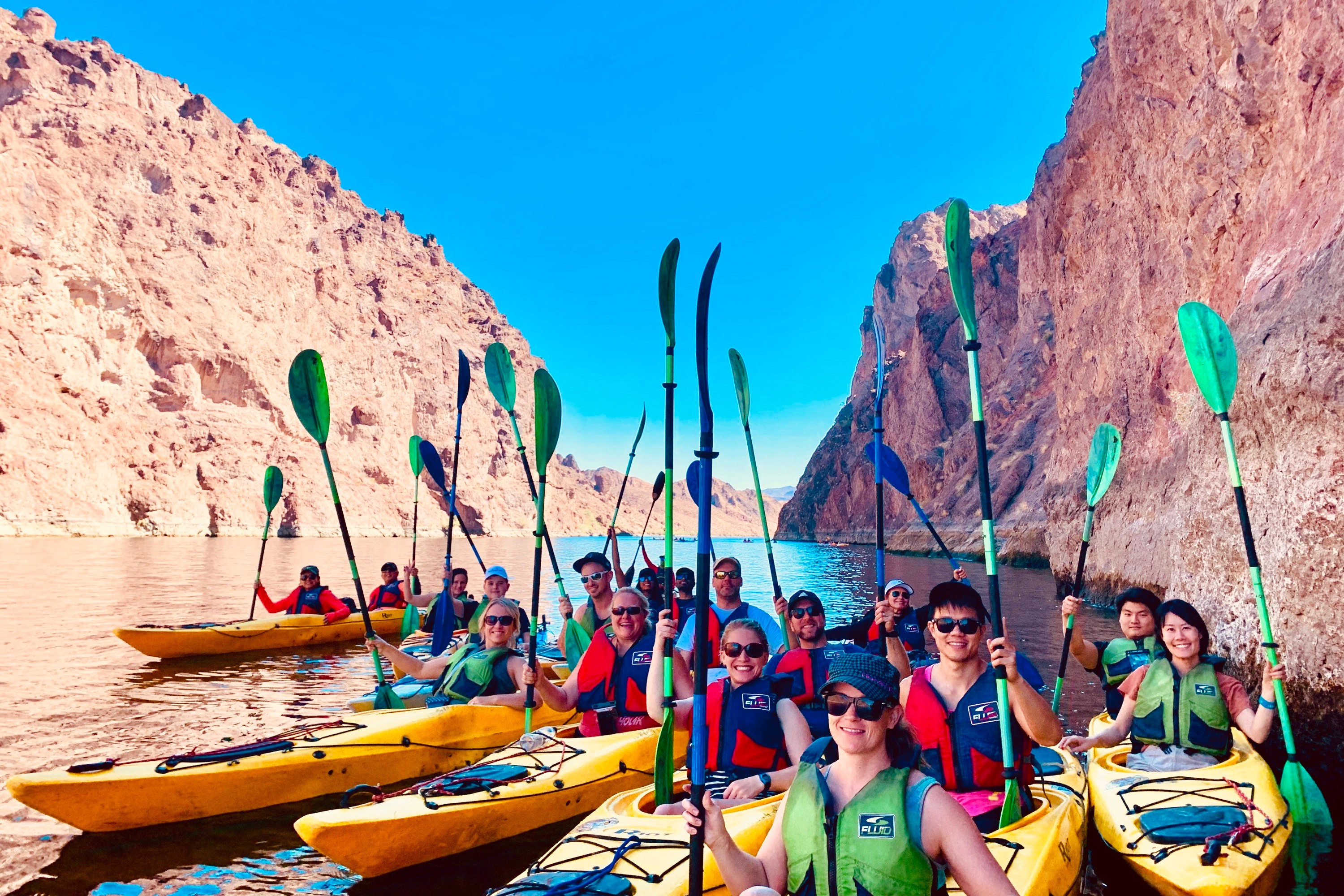 Hold on to your paddles as you kayak down the Colorado River