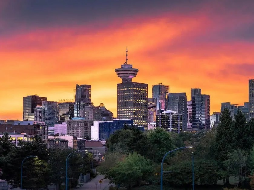 See Vancouver from above with views of Canada Place, harbour, and North Shore Mountains.