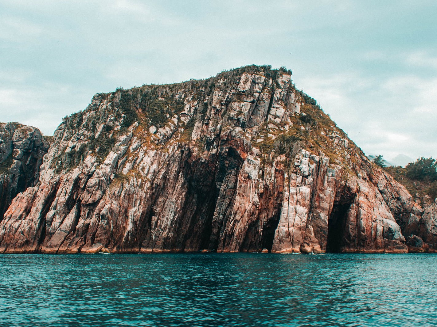 Stand beside Arraial do Cabo’s rock formations sculpted by nature over time