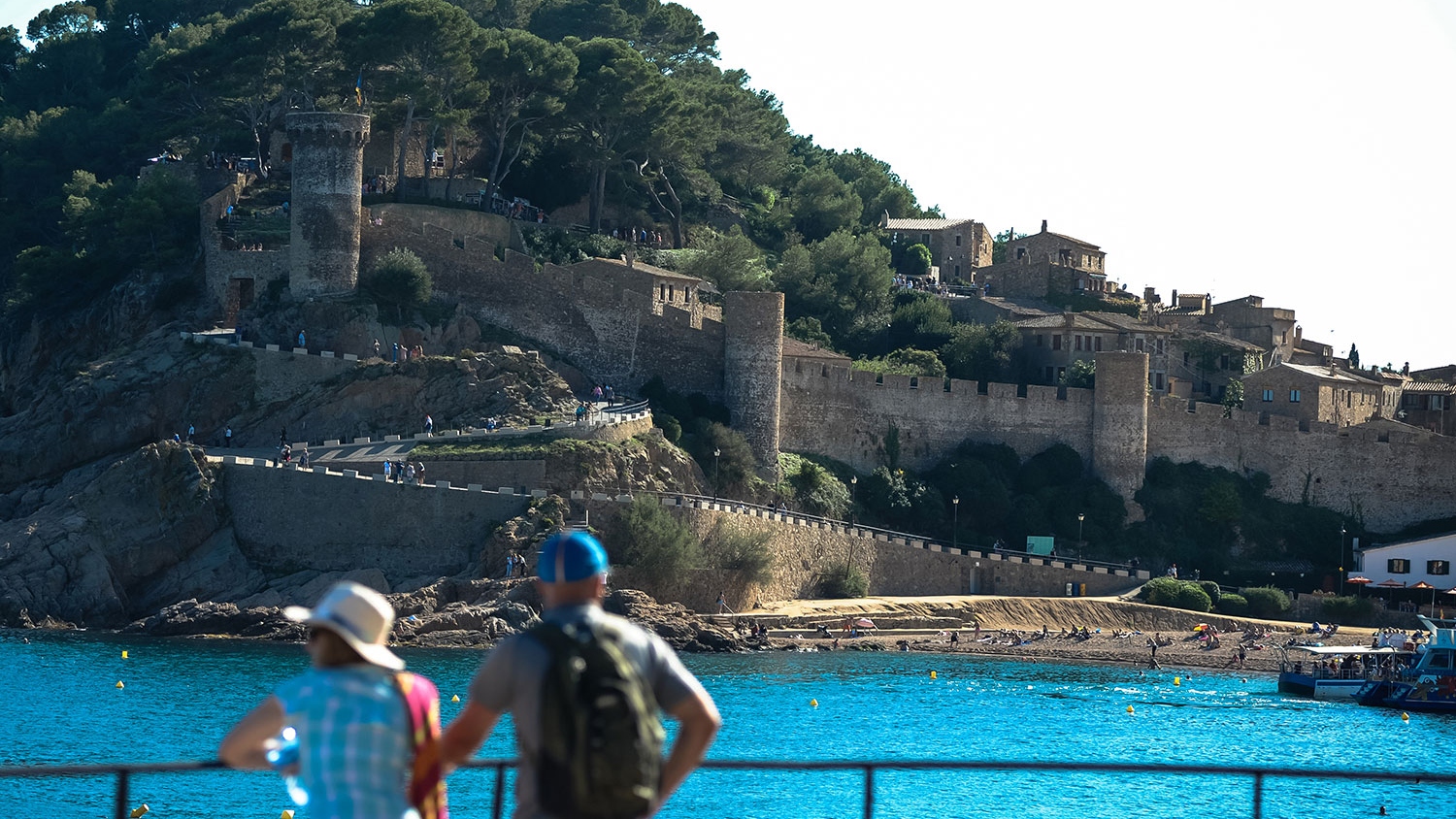 A serene moment shared, gazing over Costa Brava’s sparkling blue waters