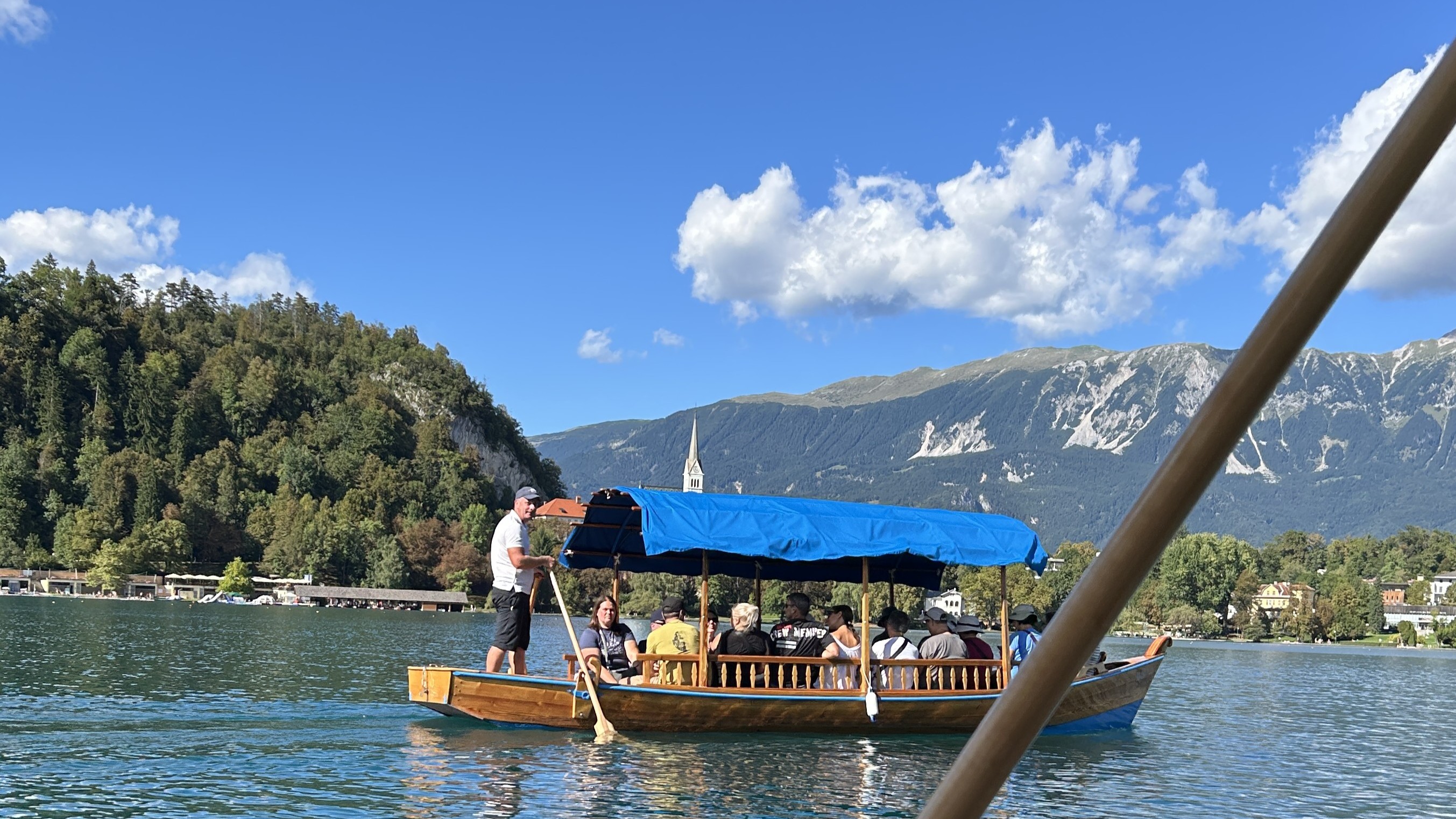 Traditional longtail boat cruising across crystal clear turquoise waters