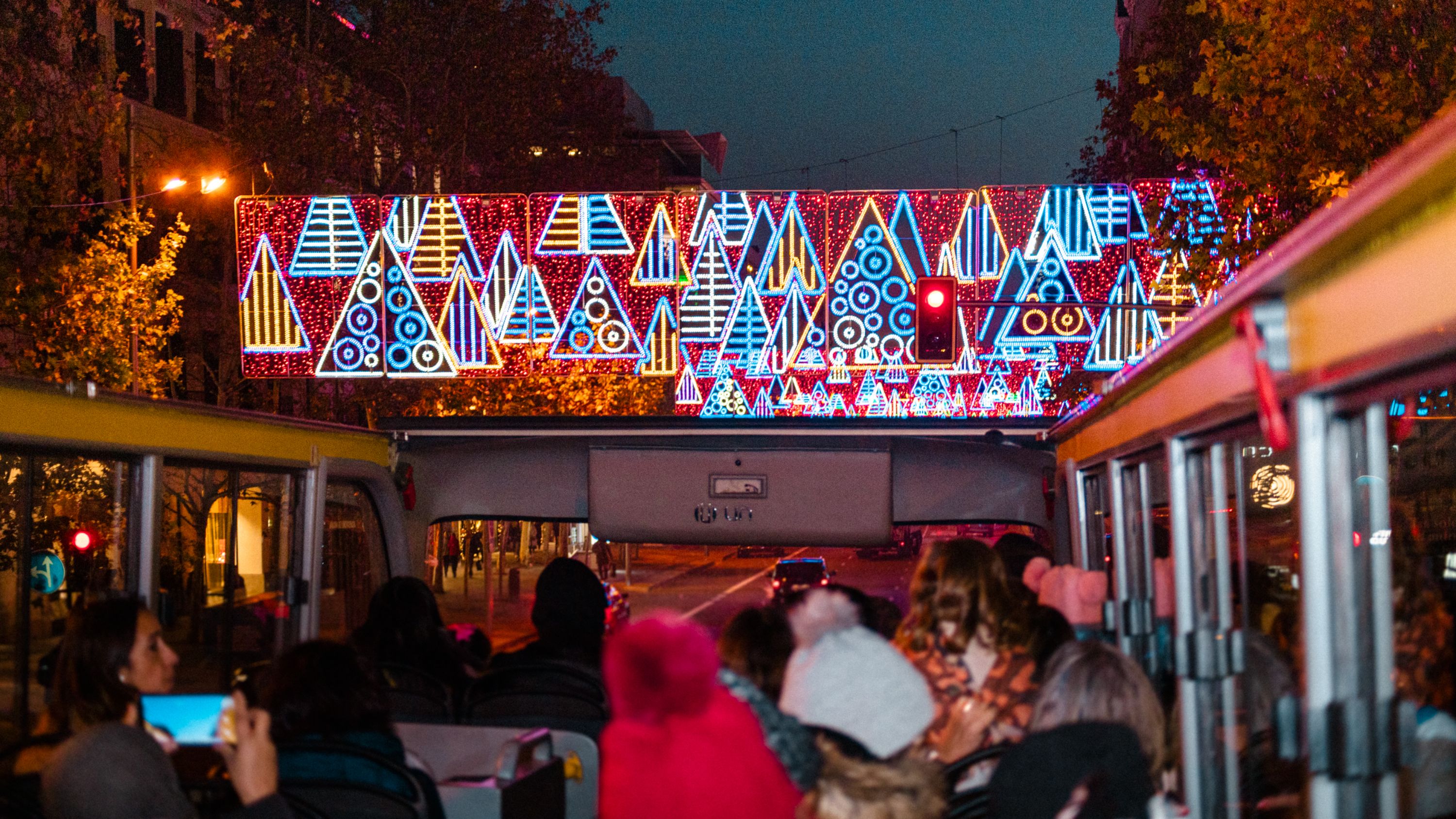 Experience Madrid's stunning Christmas lights aboard a festive open-top bus tour