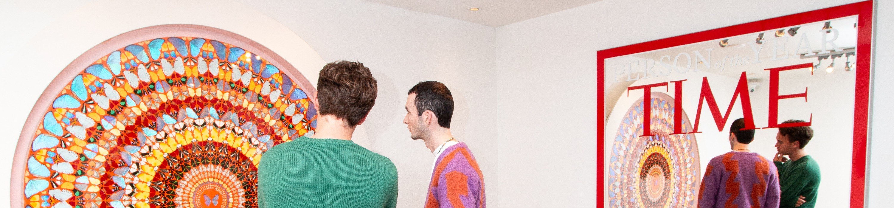 two guys standing in front of the Time mirror