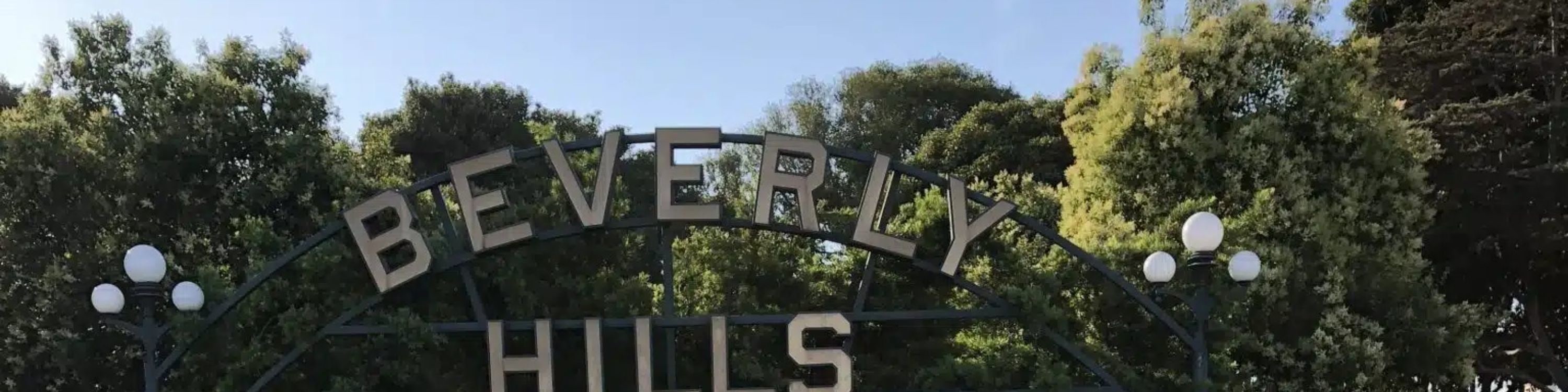Take a photo in front of the iconic Beverly Hills sign and lush gardens