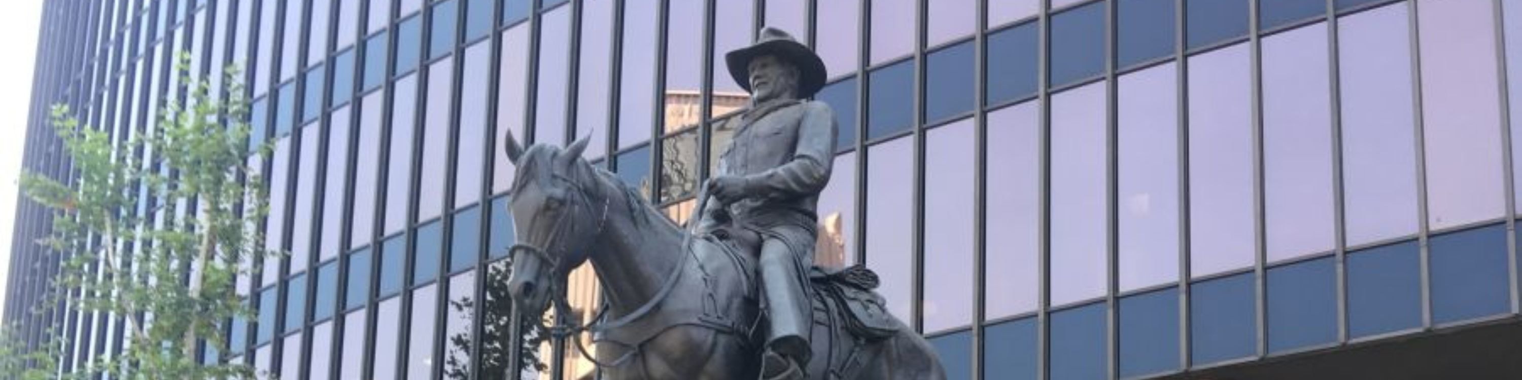 Capture a classic moment with the iconic John Wayne statue on your tour