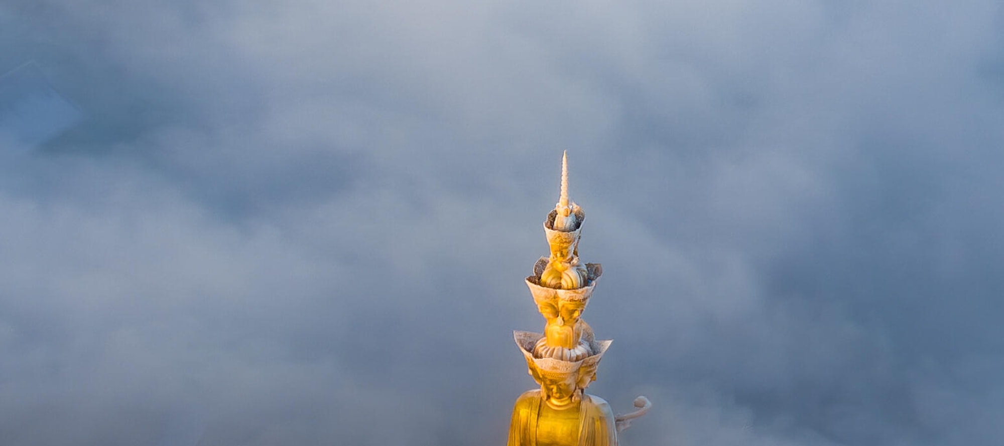 Amidst the mist, the golden Buddha of Mount Emei shines. Encounter the sacred scenery and embark on an extraordinary journey of spiritual purification