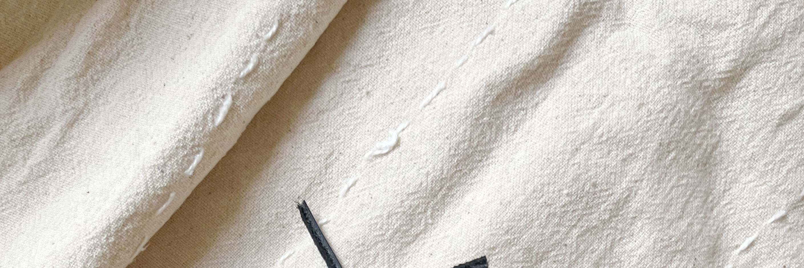 Use leather crafting techniques to easily sew together a loose bag.