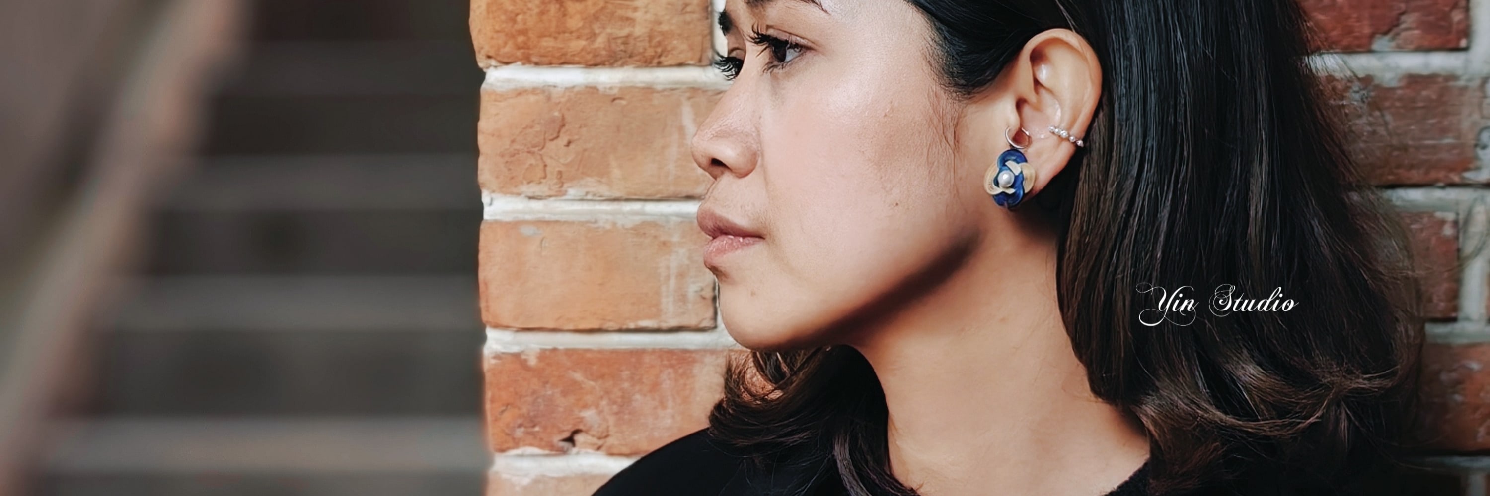 Model wtih blue earring
