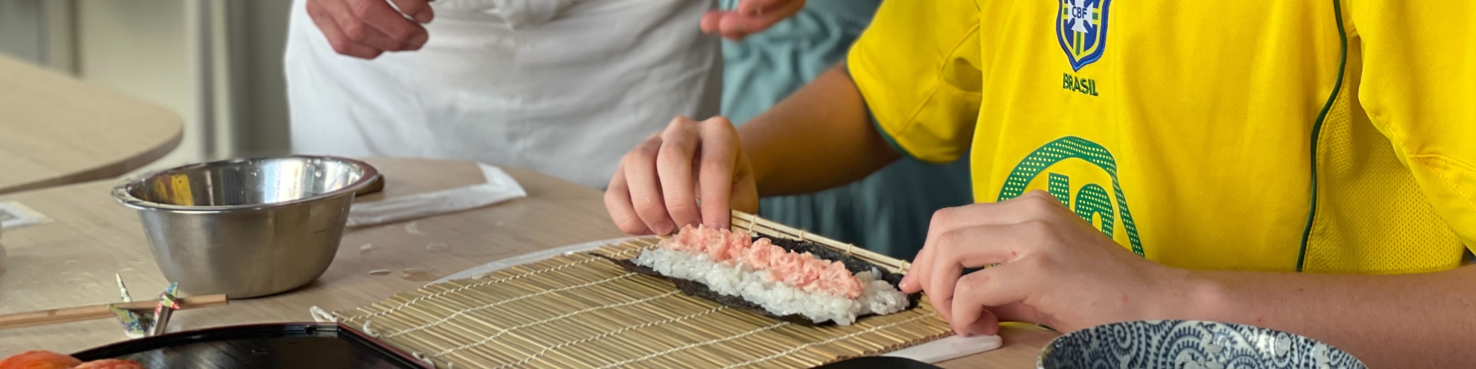 A friendly sushi chef will teach you how to make sushi.