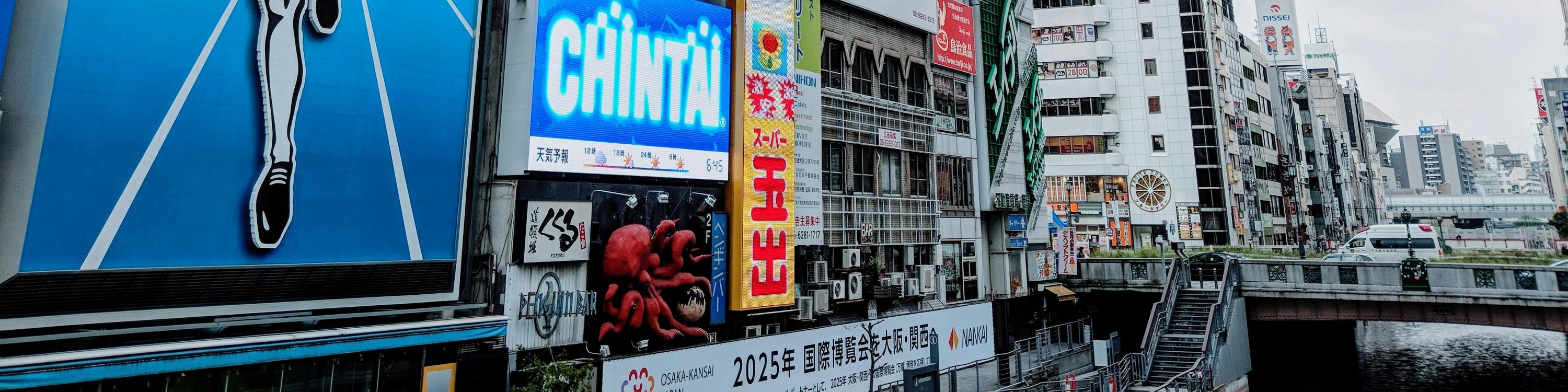 Snap iconic photos at Dotonbori’s famous landmarks, including the Glico running man and bustling canal views.