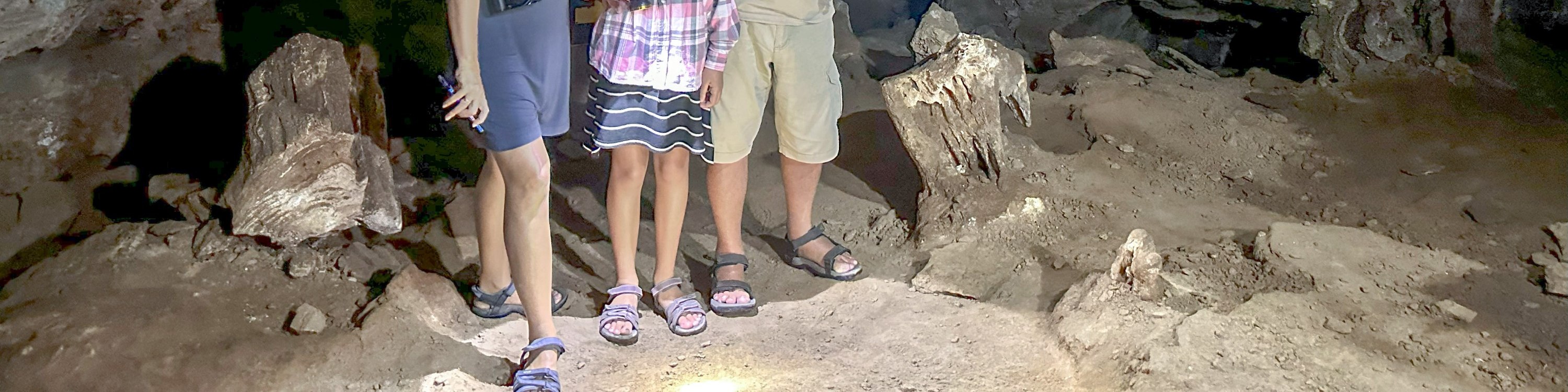 Discover the captivating inner realm of the cave, adorned with diverse stalagmites and stalactites, some resembling enchanting corals found in the depths of the sea.