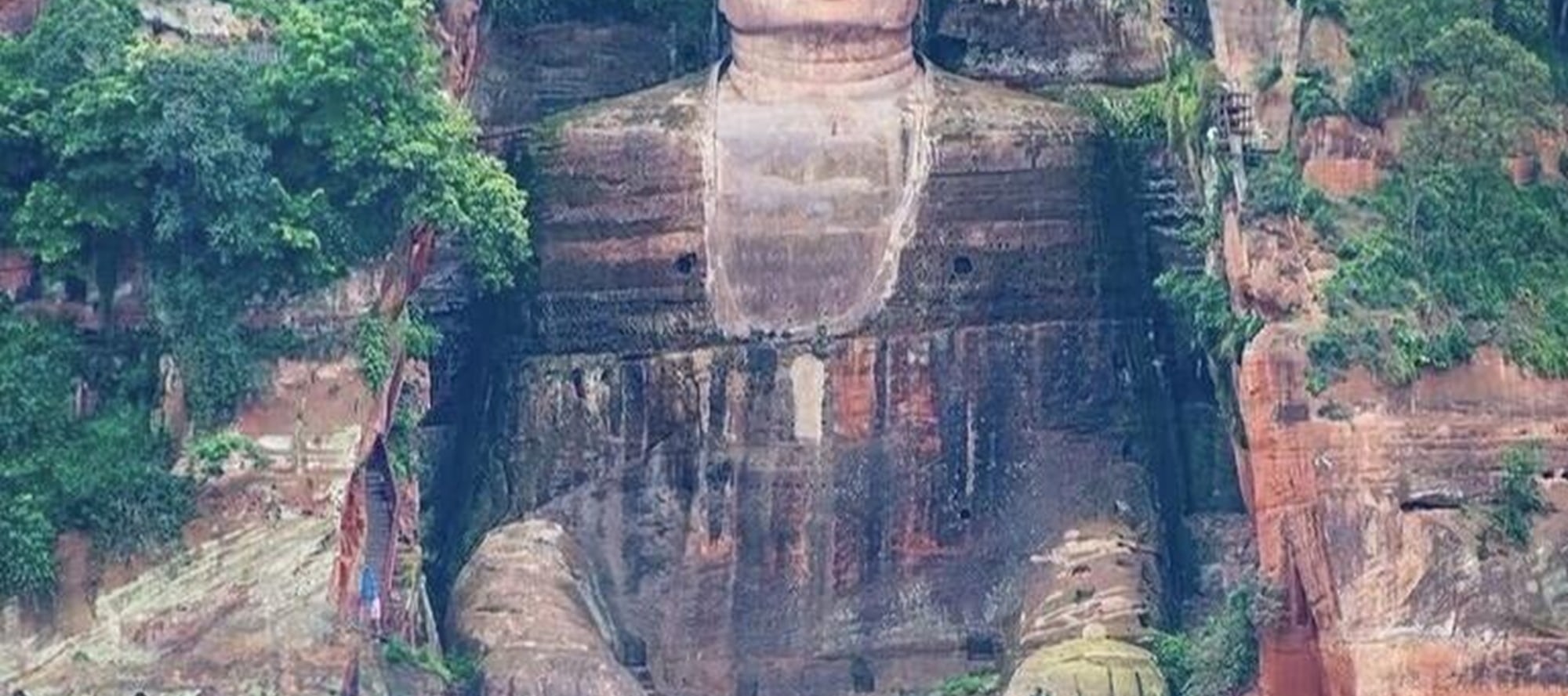 On the top of Leshan Mountain, the Giant Buddha stands tall. Between the green shadows and blue sky, witness the miracles carved by time and start a soul-stirring journey