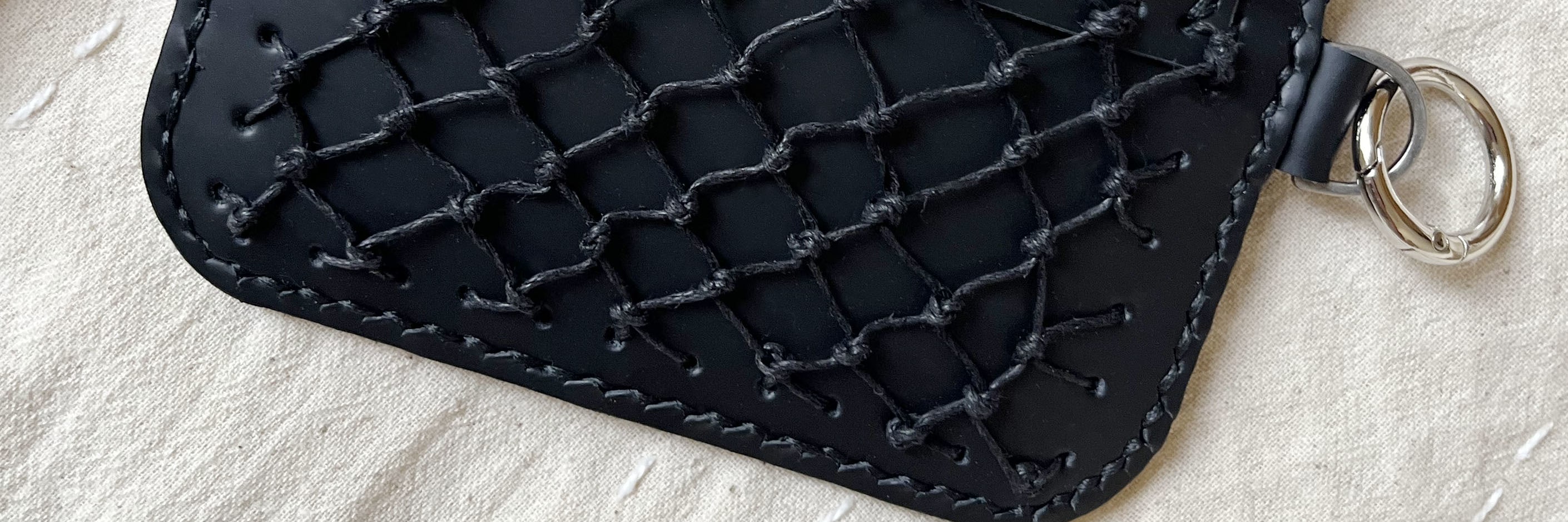 Use leather crafting techniques to easily sew together a loose bag.