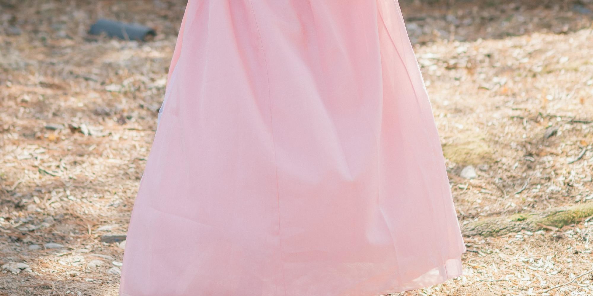 The hanbok’s vibrant colors blend perfectly with the spring scenery.