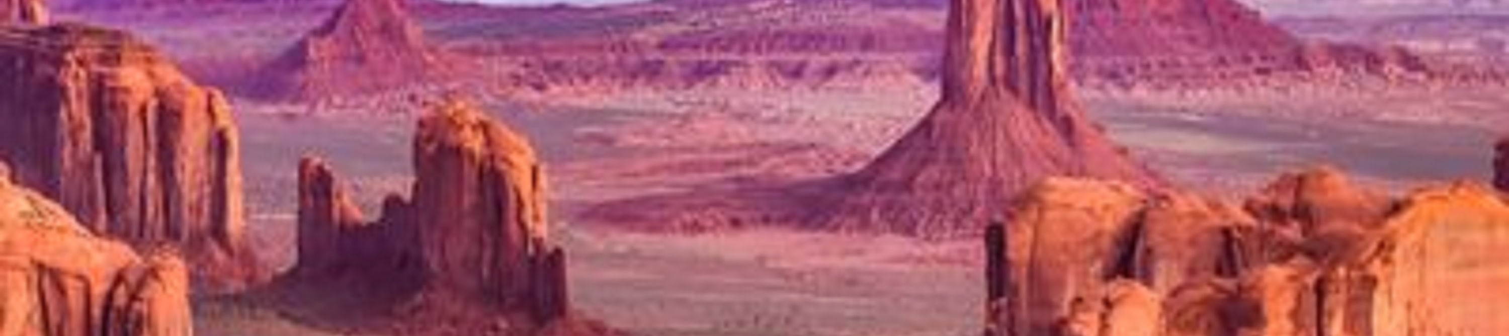 The vast desert landscape and towering buttes of Monument Valley, a famous icon of the American Southwest