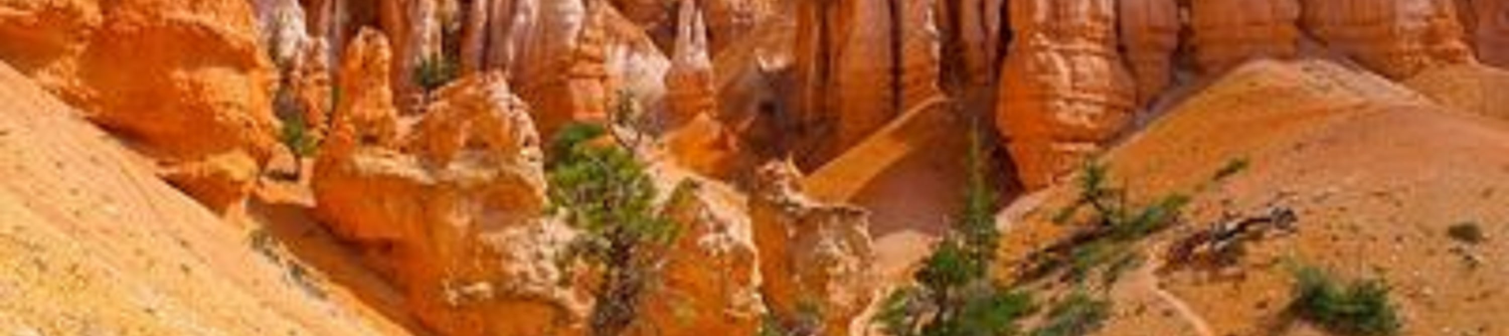 Recognizable by its vibrant orange hoodoos and dramatic rock formations under a bright blue sky