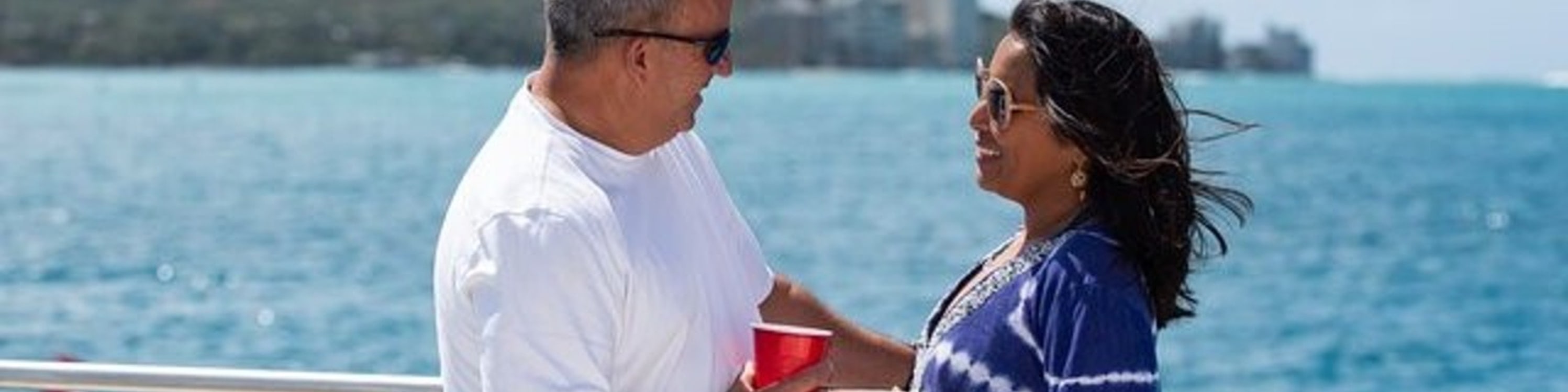 Embrace romantic moments together while enjoying the peaceful sunset cruise across Waikiki waters
