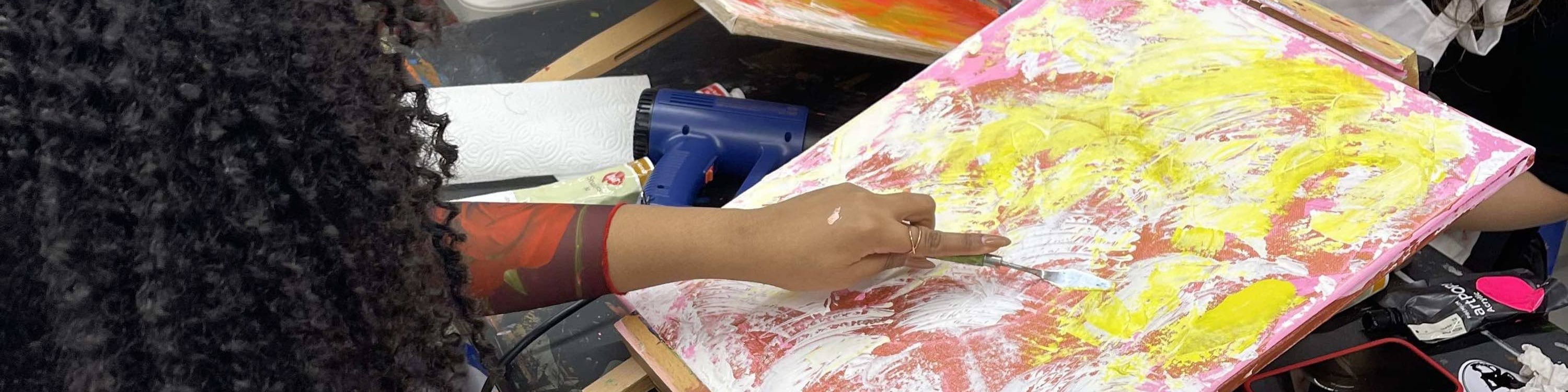 With every stroke, she dives deeper into her creation, lost in the rhythm of palette knife painting