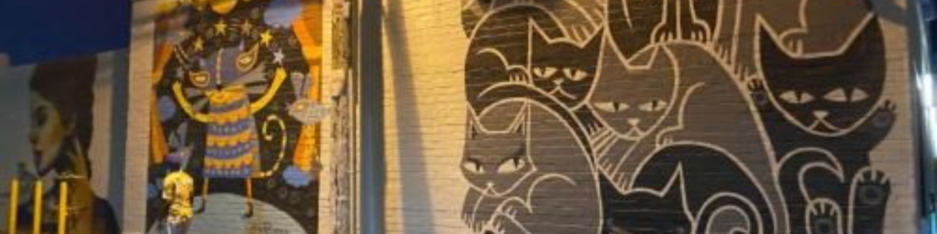 Discover striking street art tucked between vintage boutiques and hip cafes