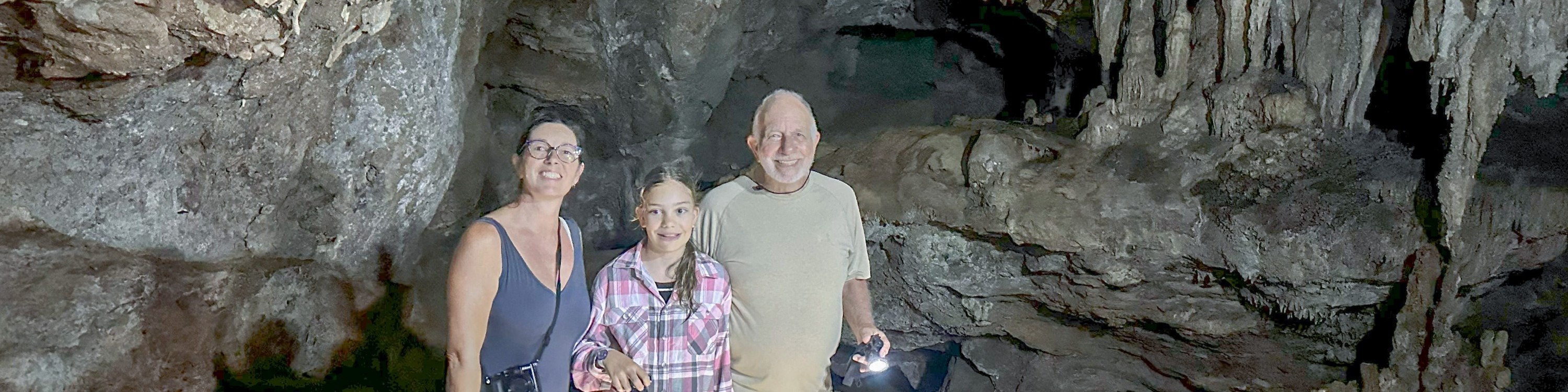 Discover the captivating inner realm of the cave, adorned with diverse stalagmites and stalactites, some resembling enchanting corals found in the depths of the sea.