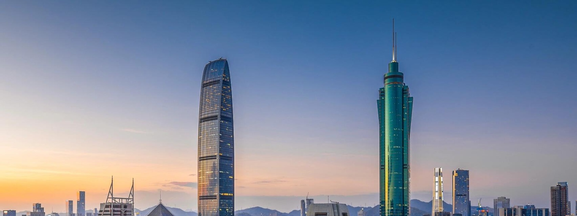 At sunset in Shenzhen CBD, skyscrapers and cars dance together, showing the prosperity of the city